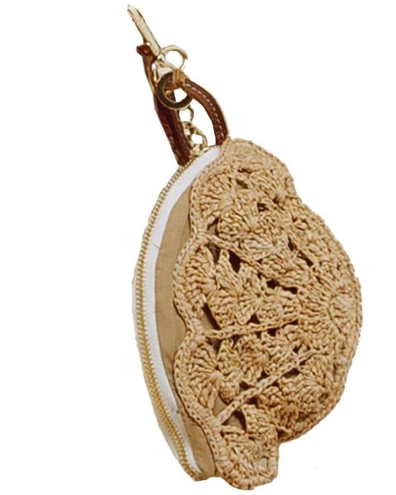 Front of a model wearing a size O/S Seashell Coin Purse in Beige Straw in Beige Straw by Sensi Studio. | dia_product_style_image_id:346356